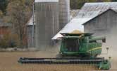 The Smith's farm: A combine, barn and farm house.